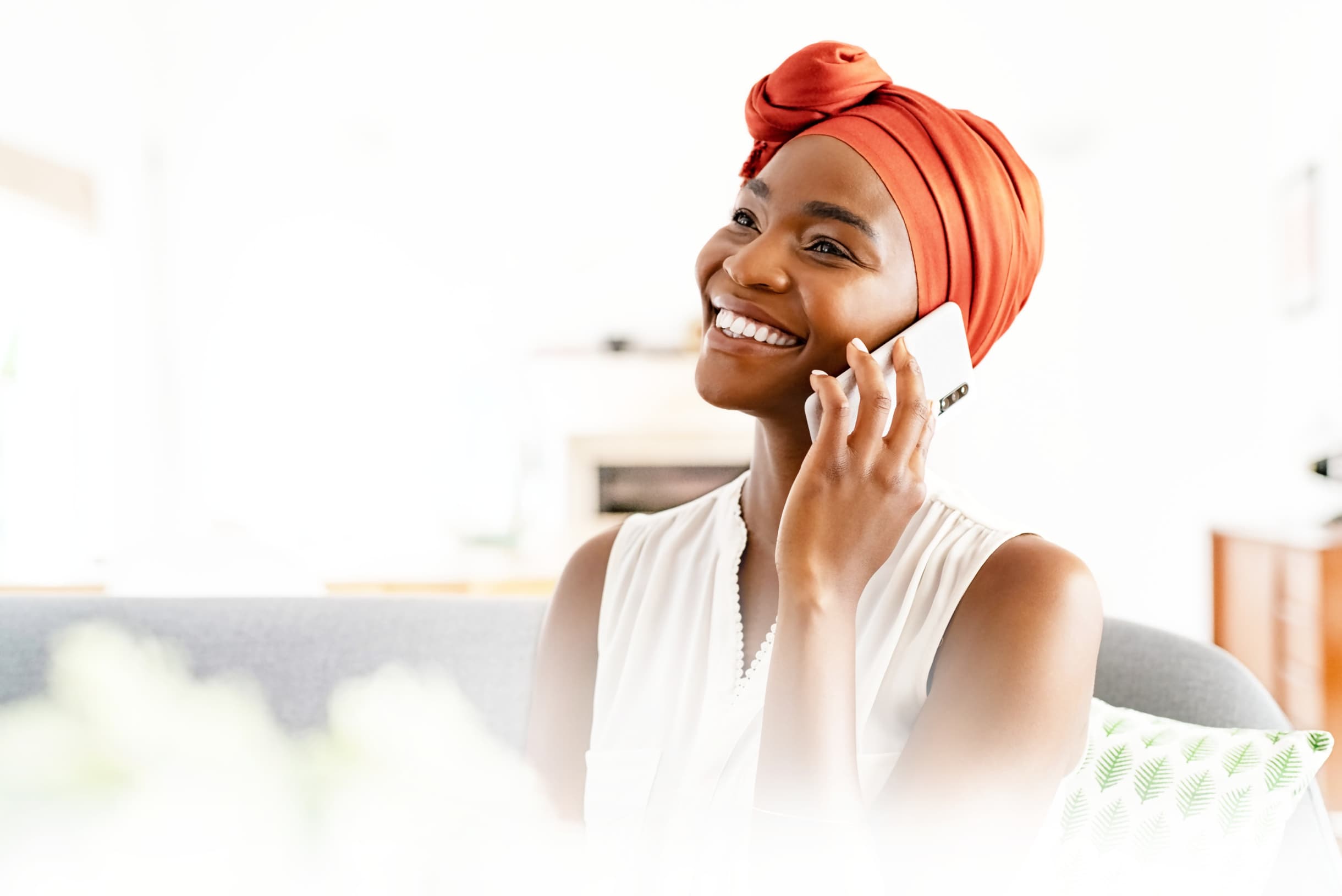 A Ghanaian seller taking a customer's call